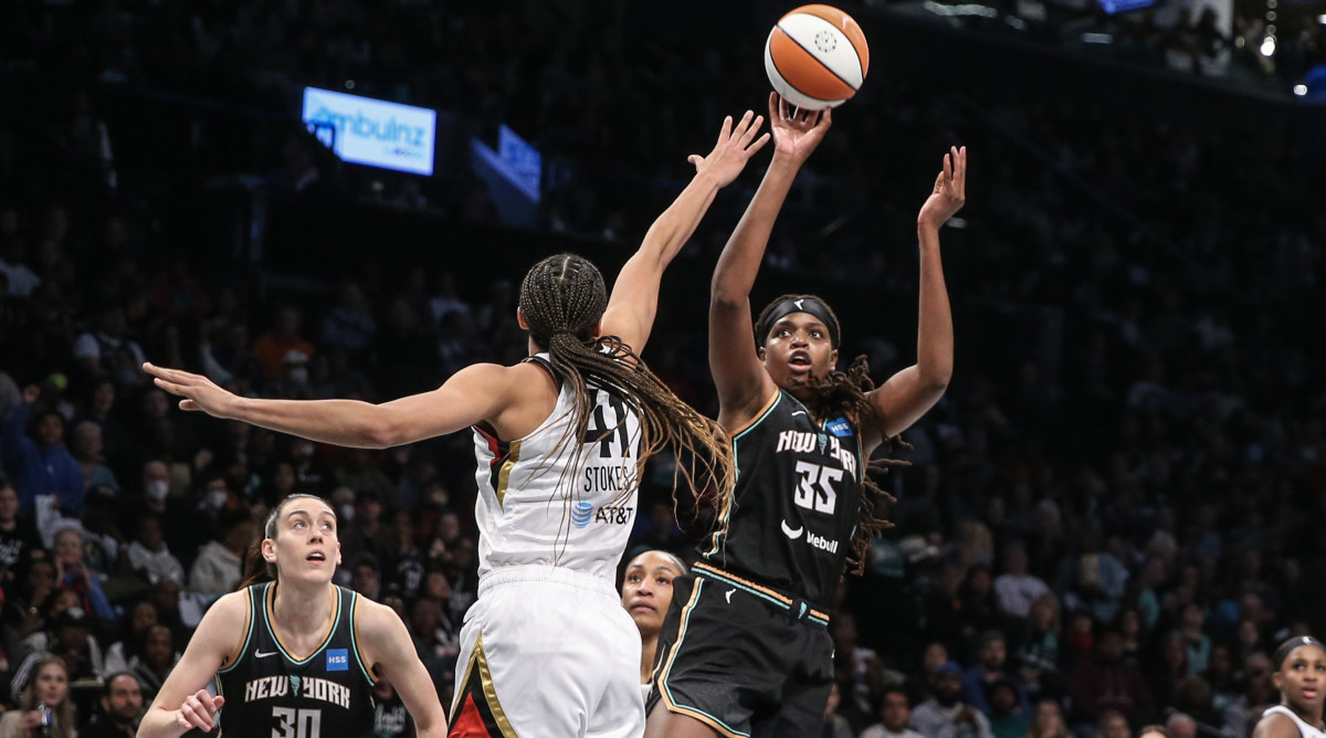 New York Liberty forward Jonquel Jones shoots over Las Vegas Aces center Kiah Stokes during the WNBA Finals.